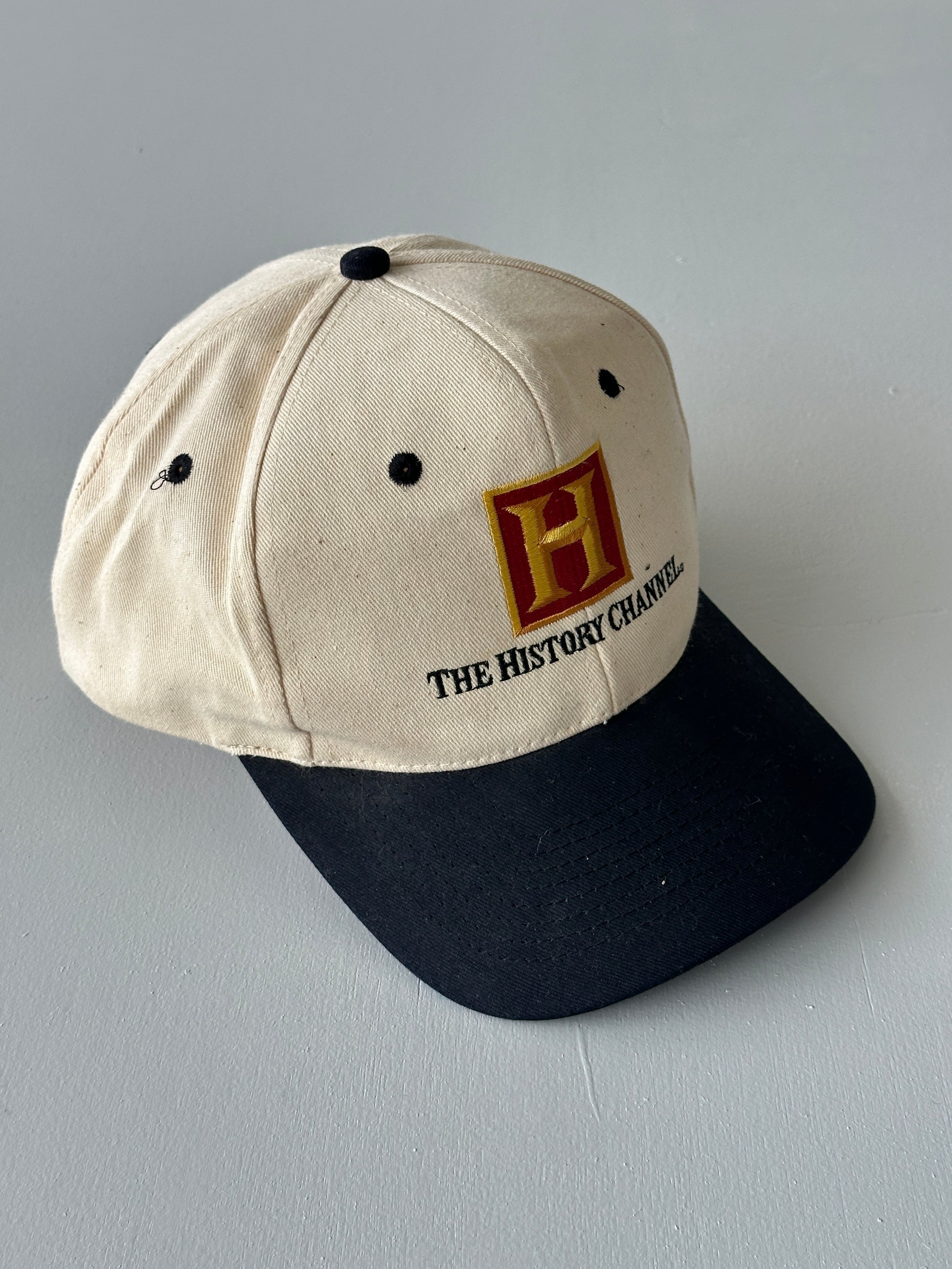 Cream / Black The History Channel 90's Vintage SnapBack Trucker Cap