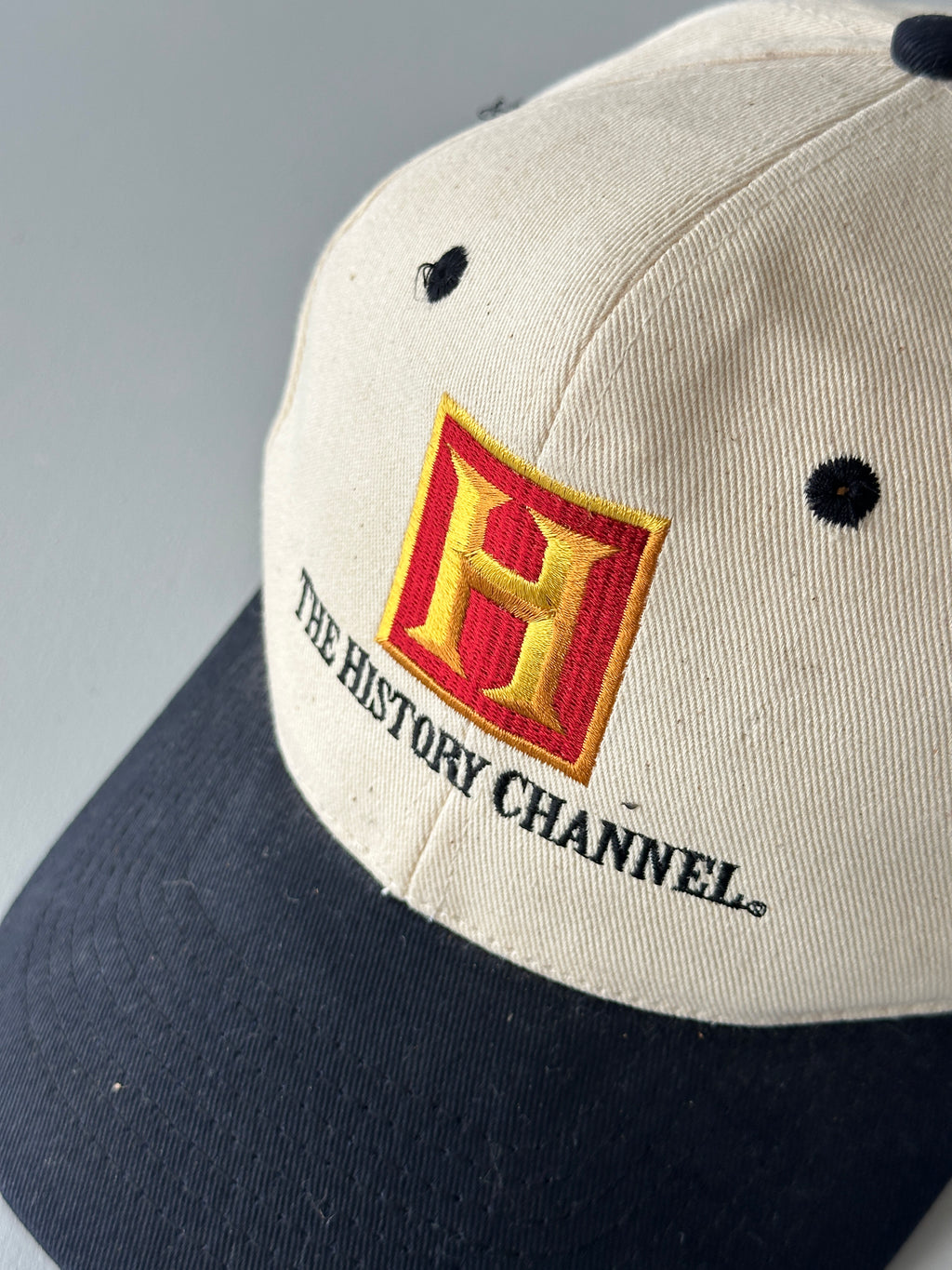 Cream / Black The History Channel 90's Vintage SnapBack Trucker Cap