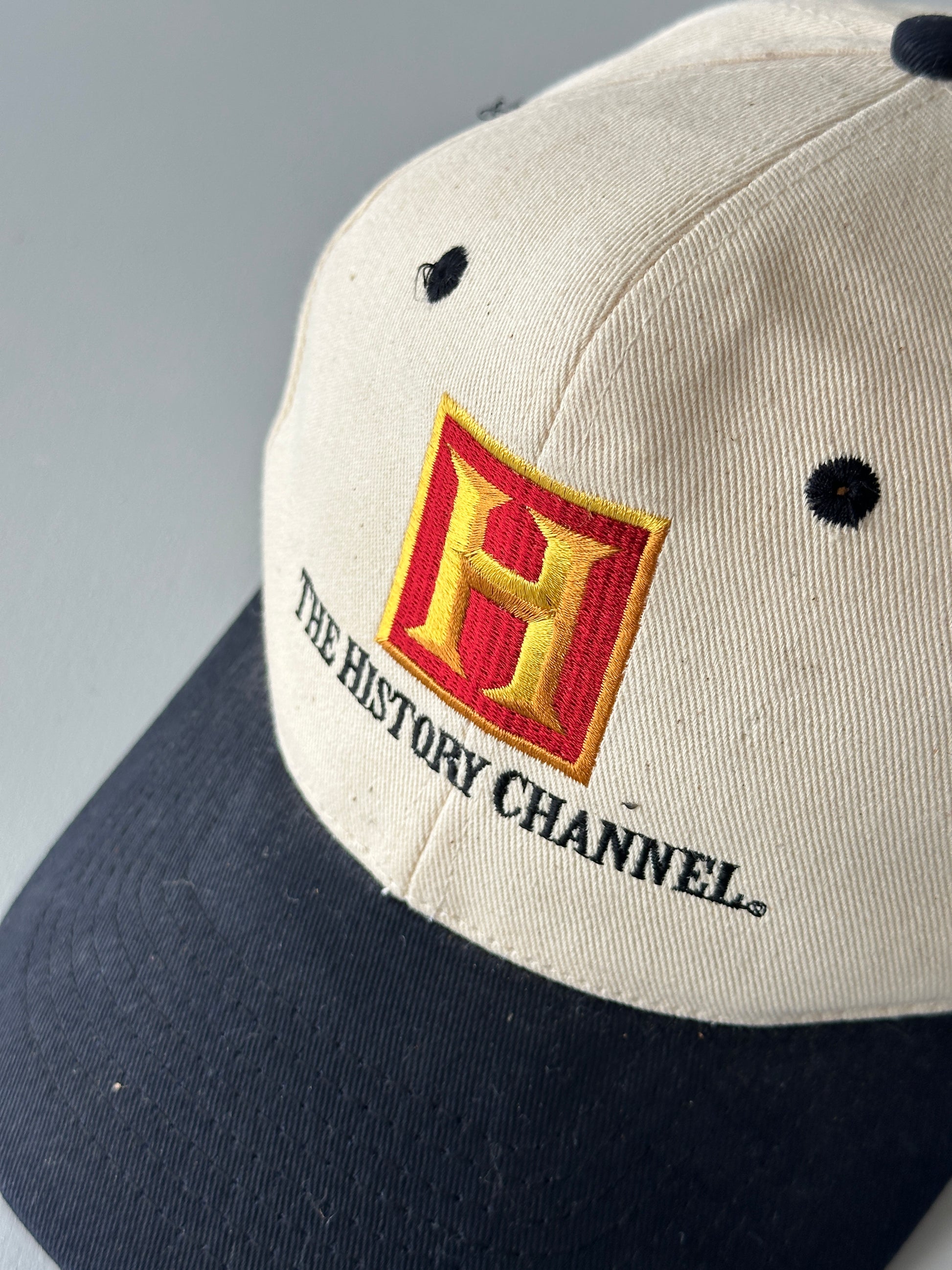 Cream / Black The History Channel 90's Vintage SnapBack Trucker Cap