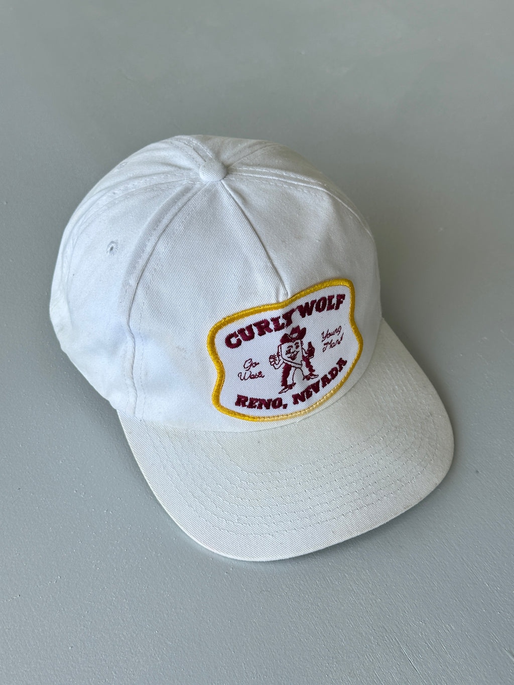 White Curly Wolf Reno Nevada 80's Vintage SnapBack Trucker Cap